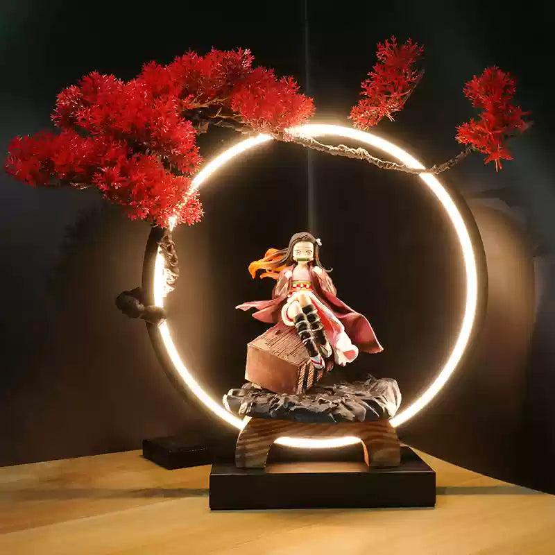 Demon Slayer Nezuko Kamado figure seated with LED circular display and red maple tree, ideal for anime collectors and fans.