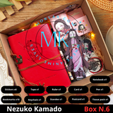 Demon Slayer Nezuko Kamado Gift Box N.6 with anime collectibles including notebook, stickers, keychain, standee, and more. Perfect gift for fans and collectors.