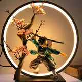 Demon Slayer Tanjiro Kamado figure with LED circular display and sakura tree, ideal for anime collectors