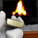 Bottom view of a Zippo lighter showing the stamp 'Bradford, PA, Made in USA,' highlighting its authenticity and premium craftsmanship.