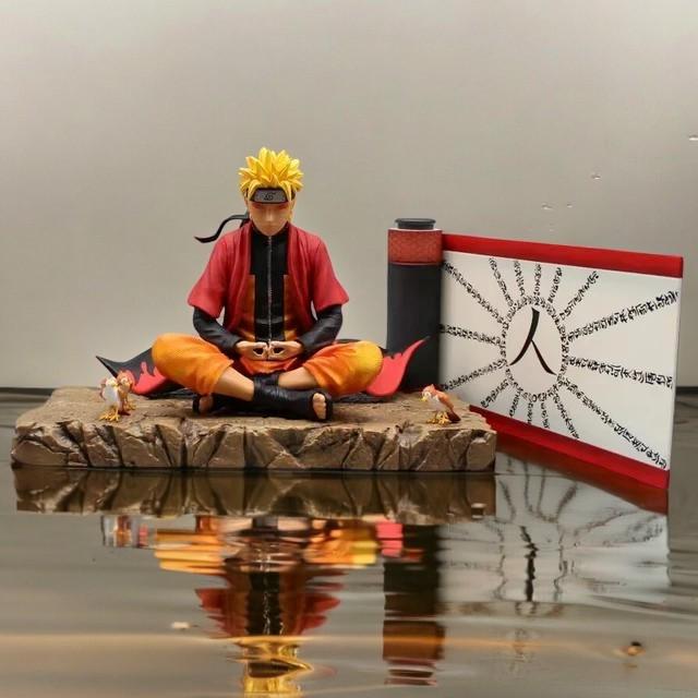 Naruto meditation figure with scroll and water reflection