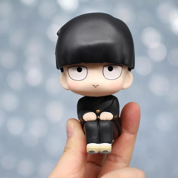 Cute chibi figure of Mob from Mob Psycho 100 held in hand - perfect collectible for anime fans