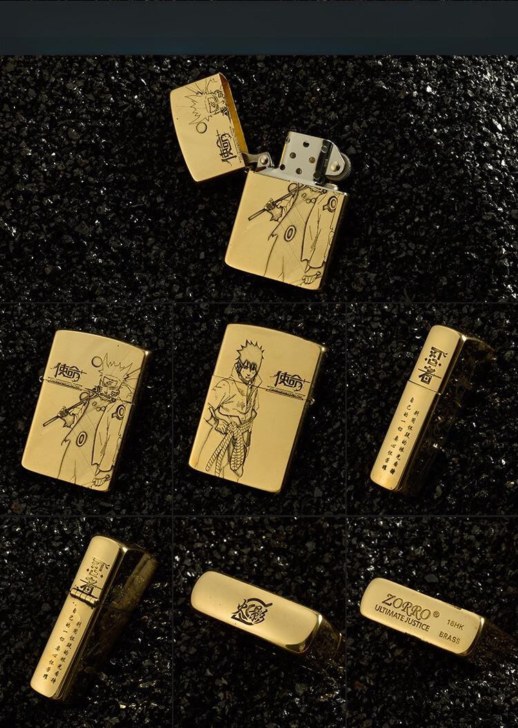 Gold Naruto engraved brass lighter on black background.