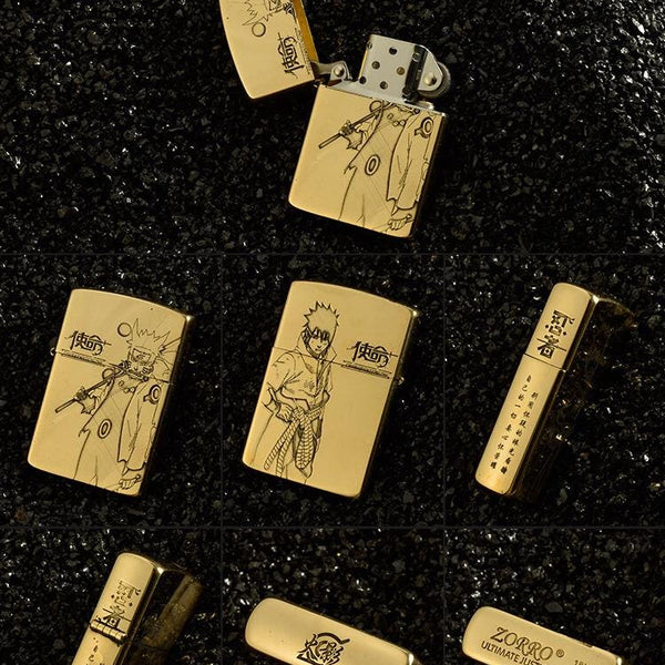 Gold Naruto engraved brass lighter on black background.