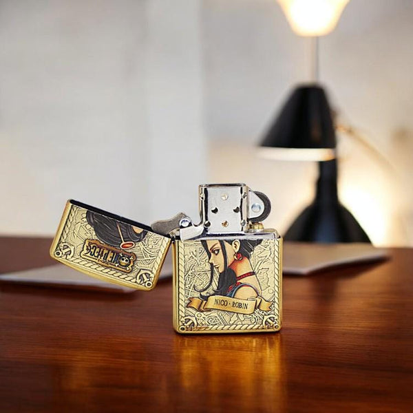 Open brass lighter with Nico Robin from One Piece on a table - collectible for anime fans