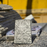 Front view of Zorro 3D metal lighter featuring Goku from Dragon Ball with a dragon relief design, displayed outdoors on a stone surface.